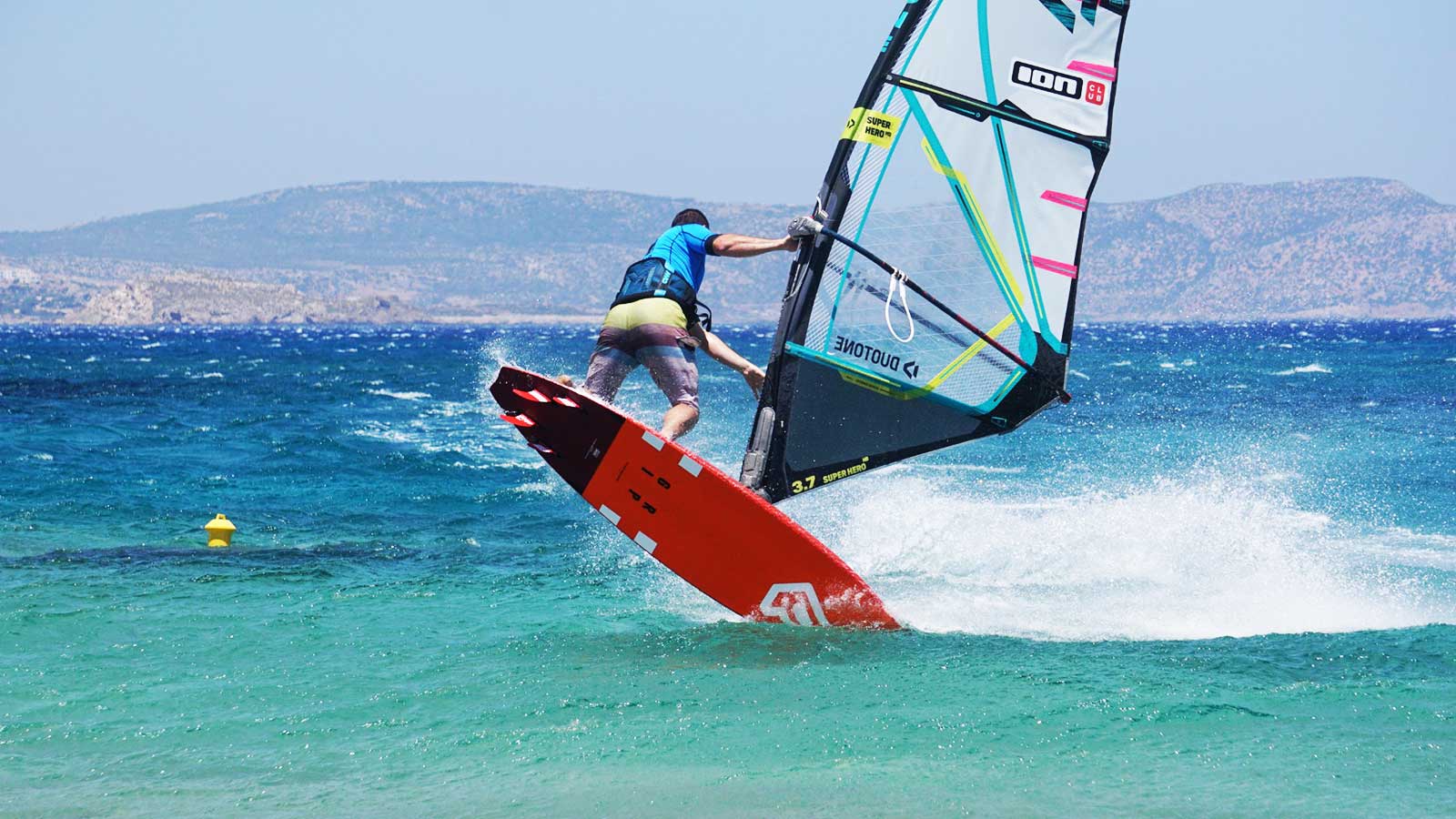 windsurfer jumping on the spot at Ion club Karpathos during a windsurf sessions