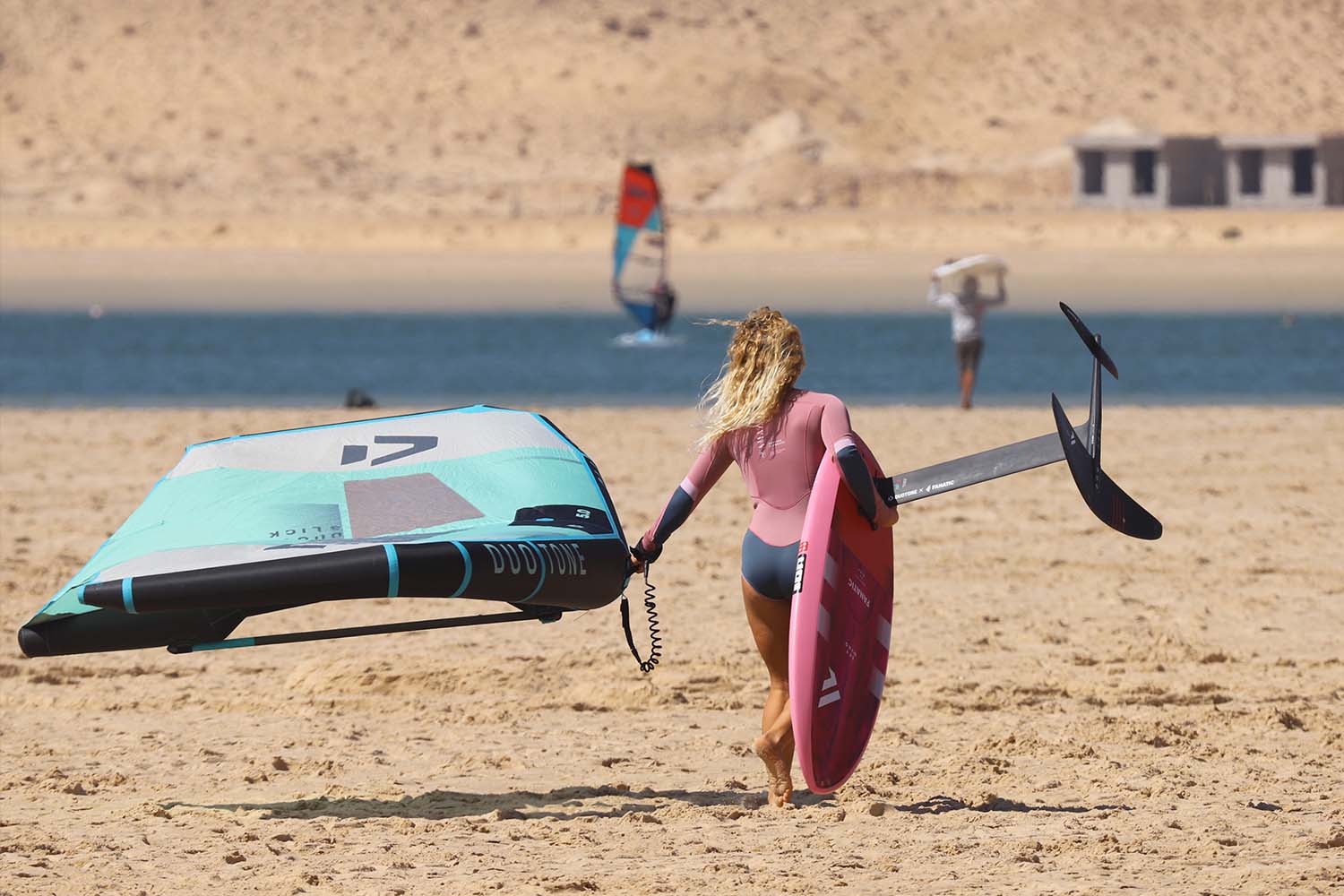 wingsurfer on the beach in front of ION CLUB Dakhla Lagoon