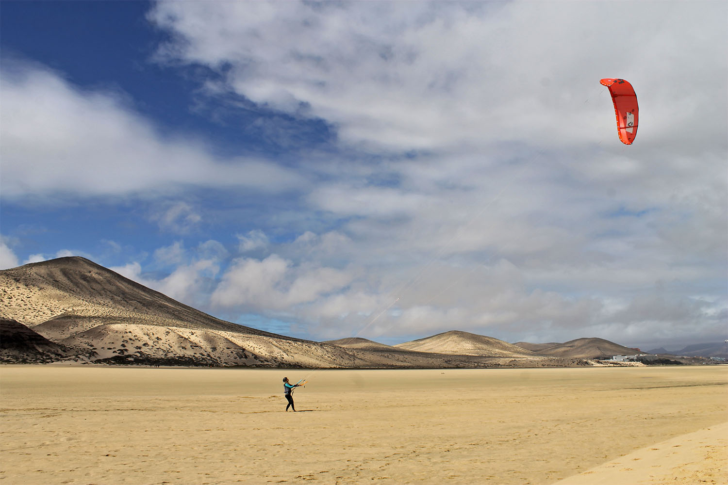 Kitesurfer on the spot beach in front of ION CLUB Risco del Paso
