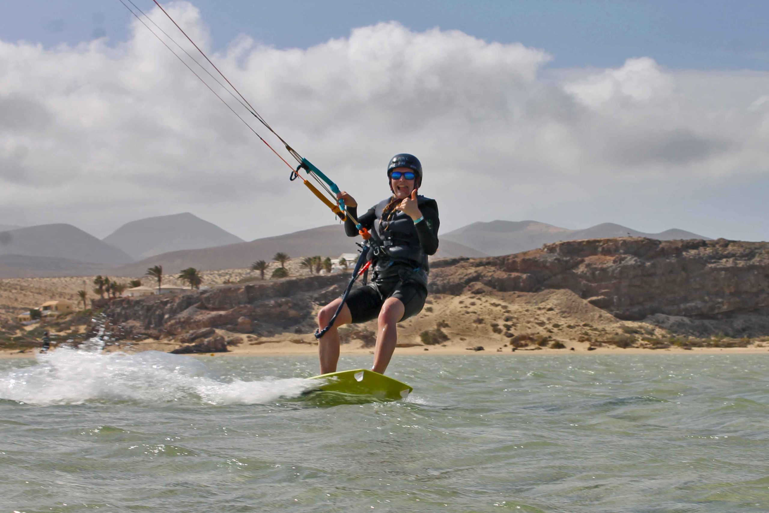 A happy guest learn kitesurf on the spot in front of ION CLUB Risco del Paso