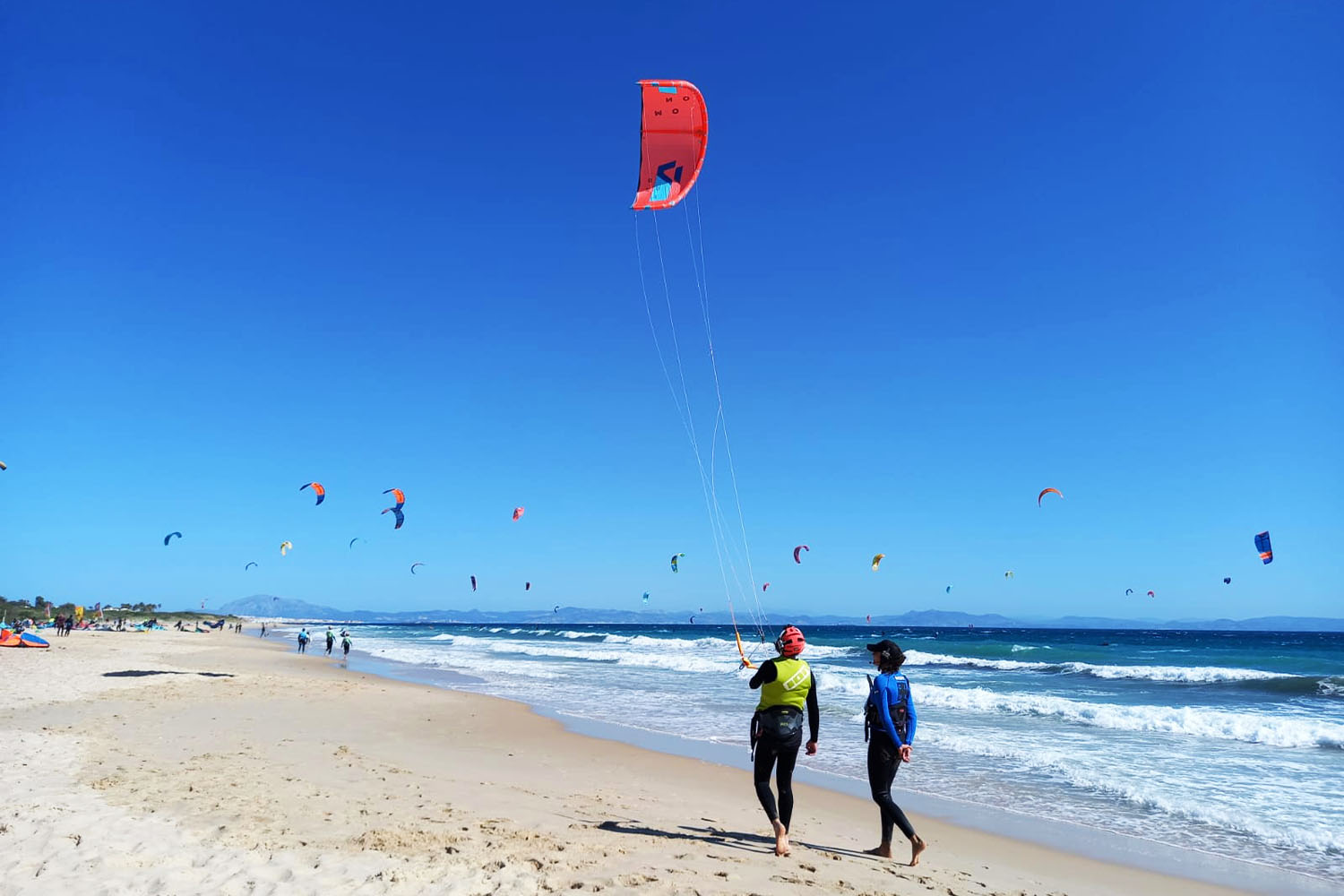 Kitesurf beginner lesson on the beach in front of the ION CLUB Tarifa center