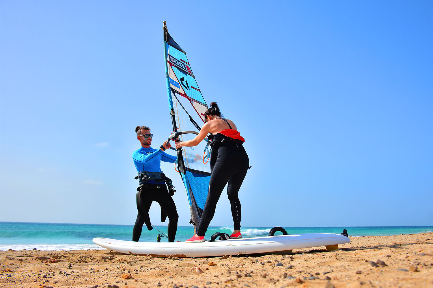 A guest learn windsurf on the beach on front of ION CLUB Cabo Verde