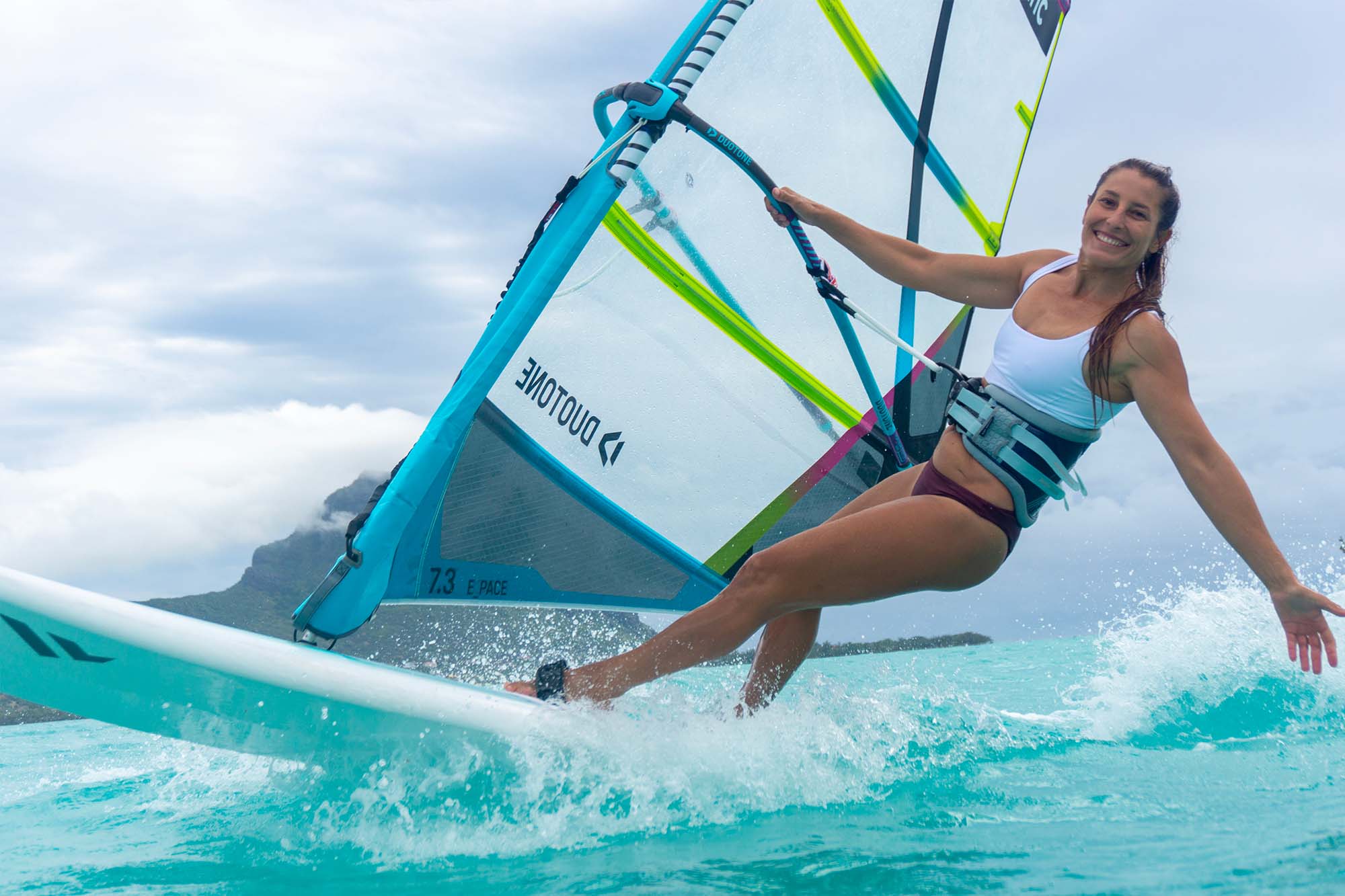 A WINDSURFER ON THE WATER IN MAURITIUS