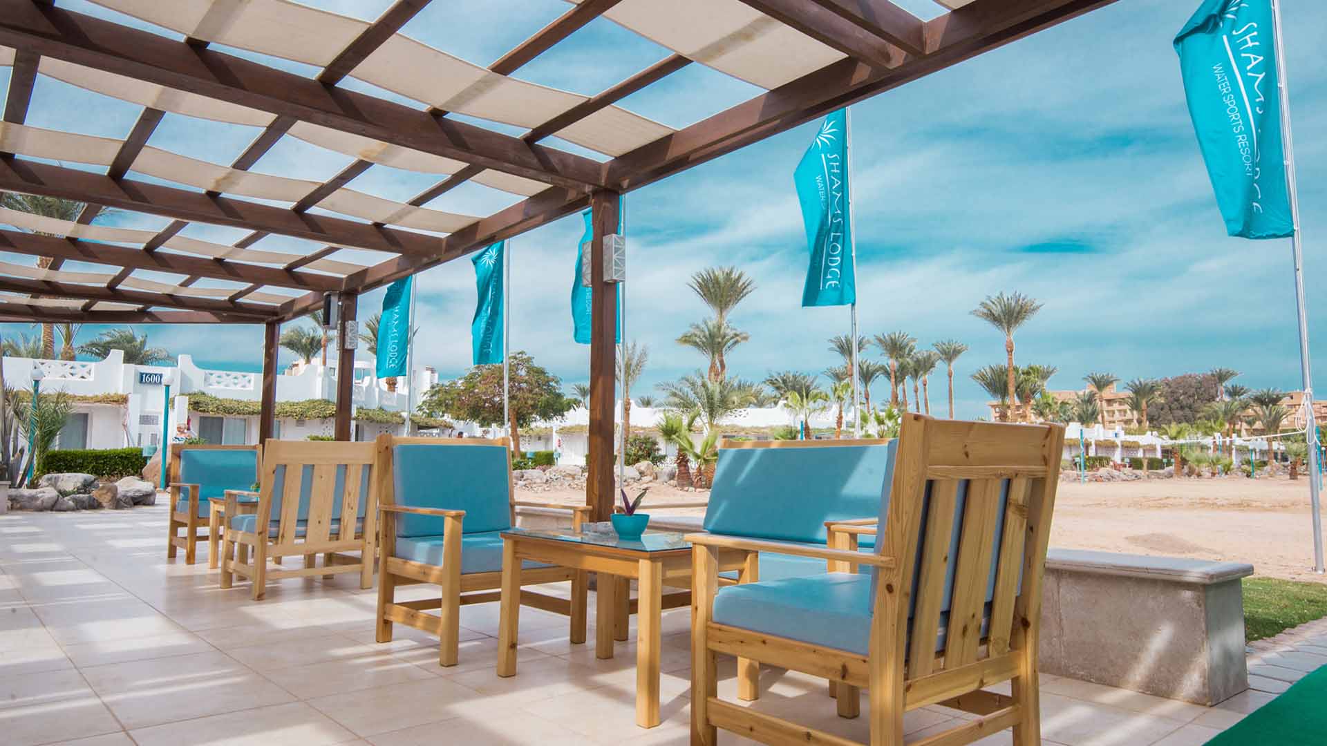 terrace of shams lodge on the beach of safaga with flags