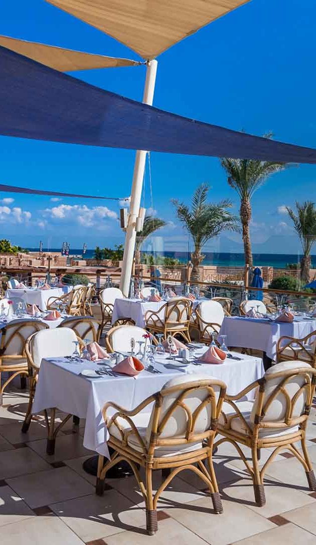 view of the restaurant in the middle of the desert in front of the lagoon