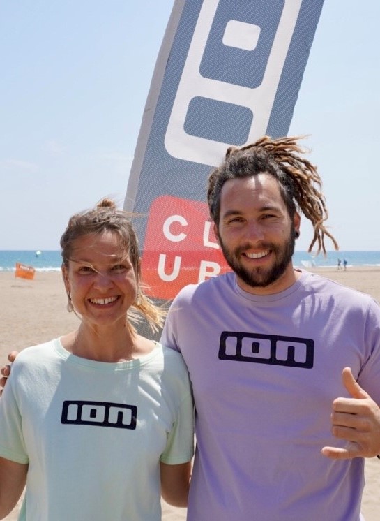 man and girl on the beach with tshirt pink and green