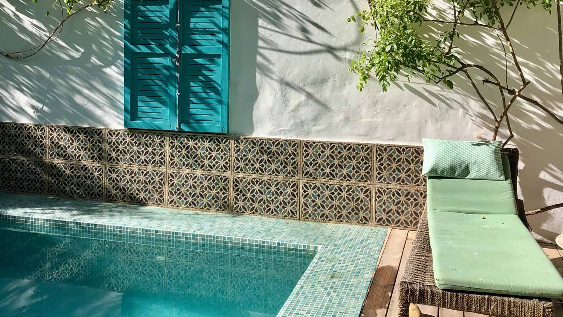 swimming pool with blue moroccan decoration
