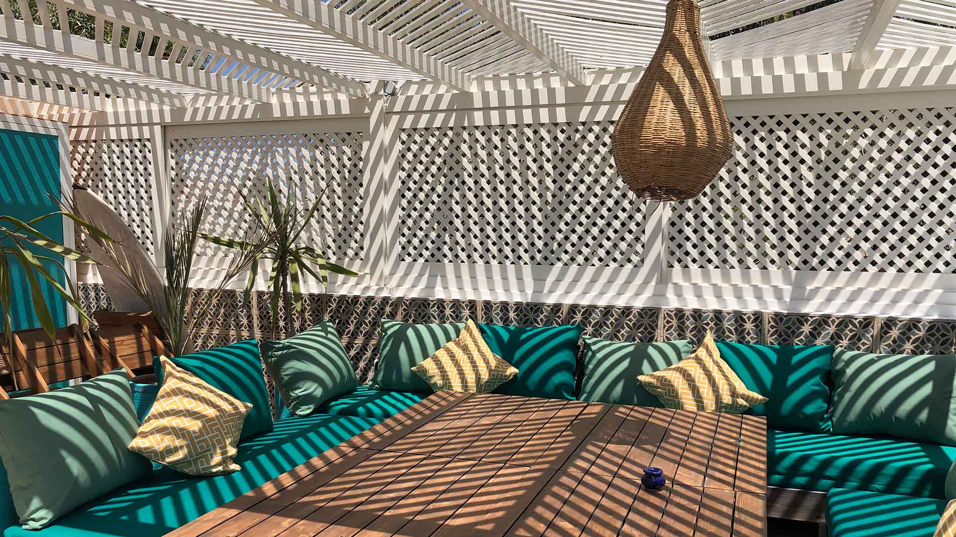terrace vent des dunes terrace with wood and blue sofa and palmers