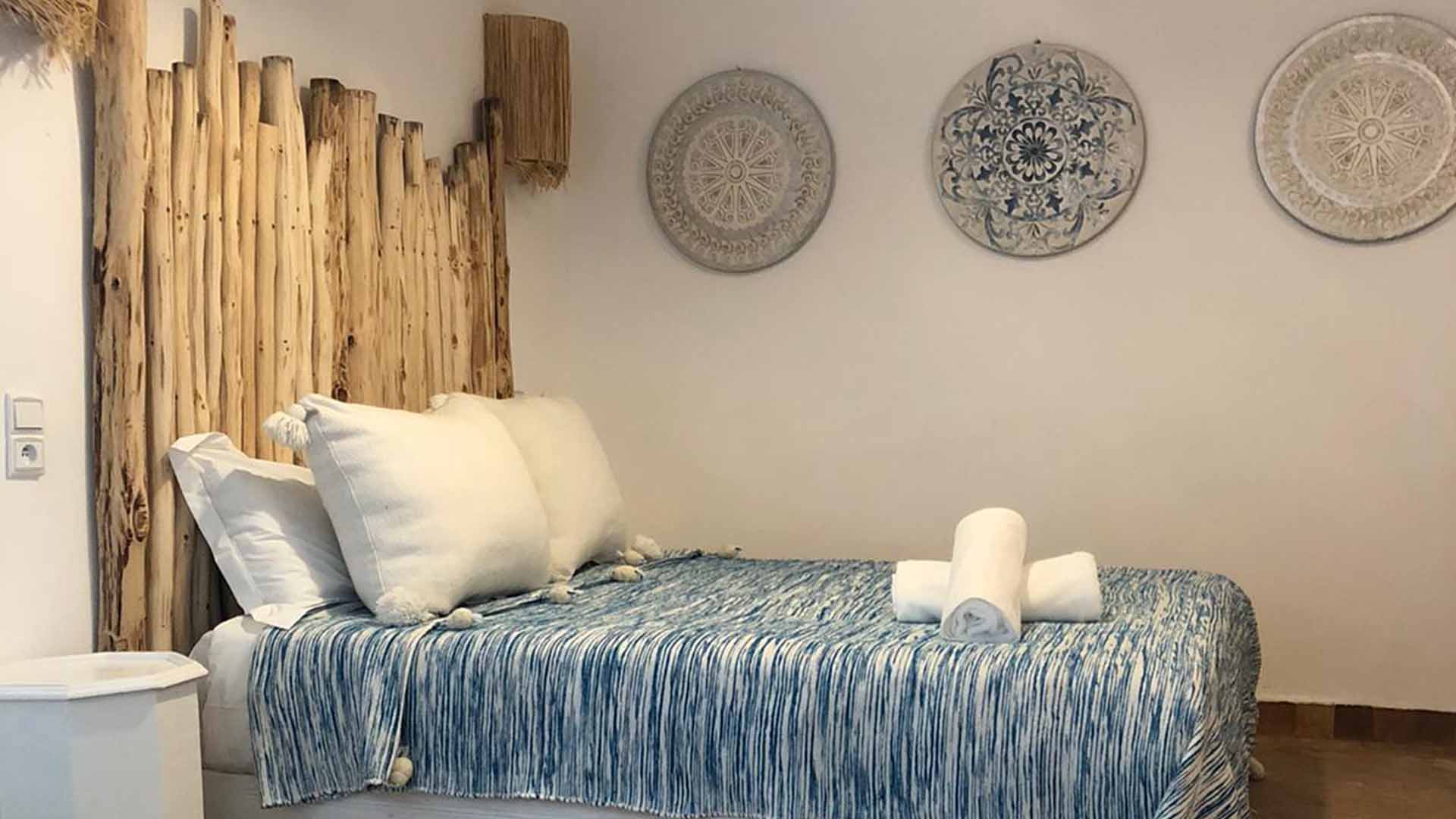 bed in a room with wood