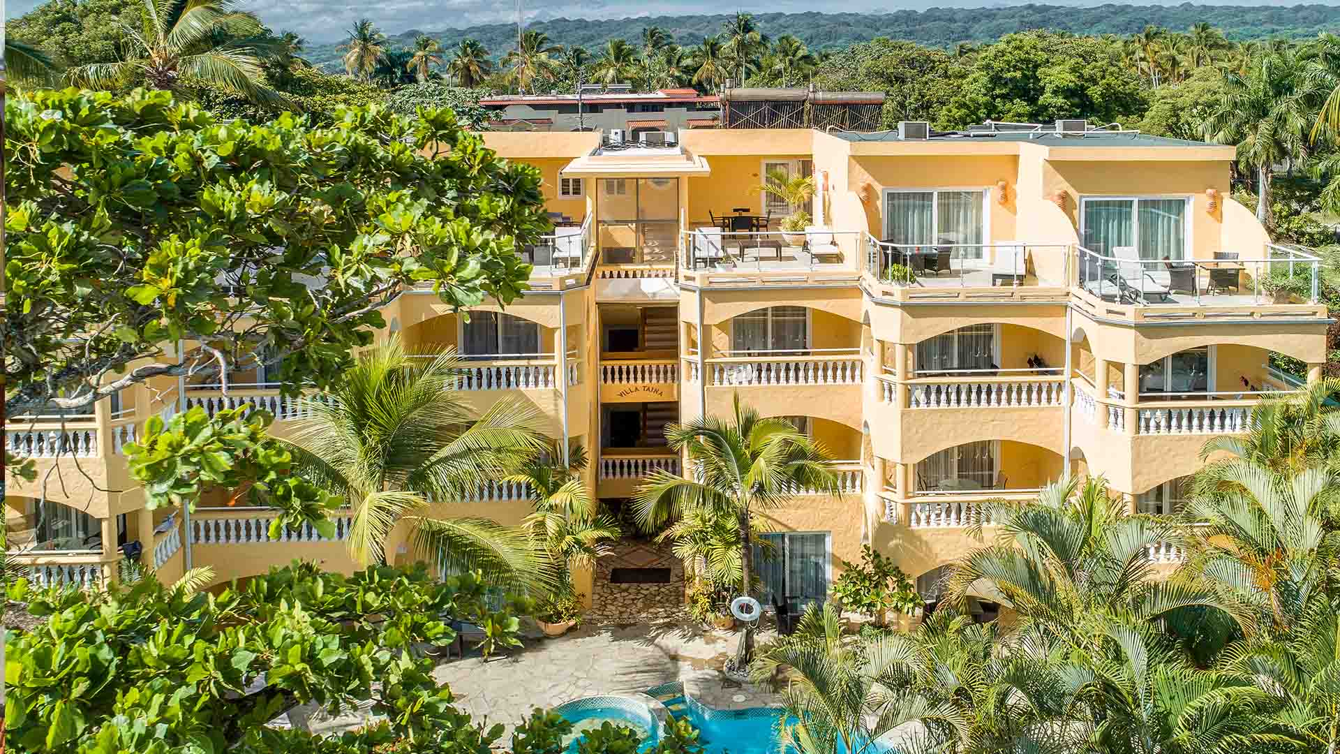 Villa taina hotel in cabarete surrounded by palmers