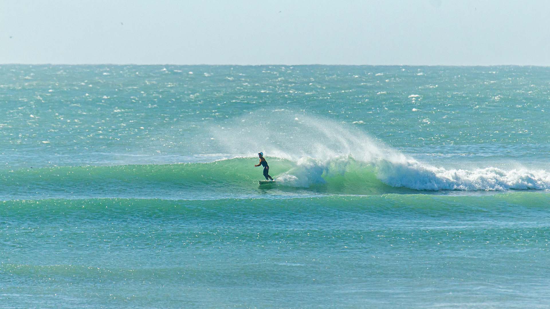 pool in the Sahara desert with a sunset