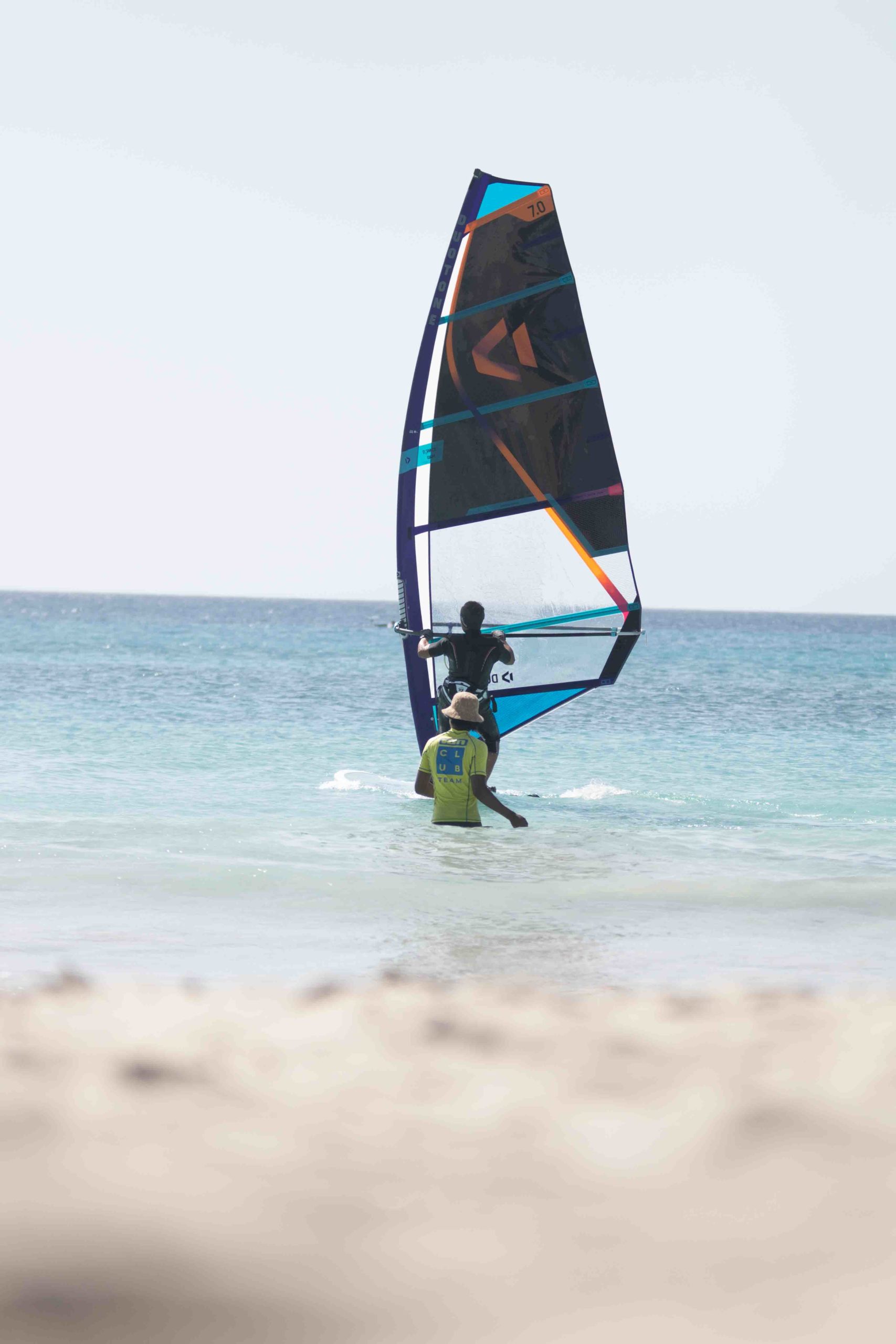 windsurf with turquoise water