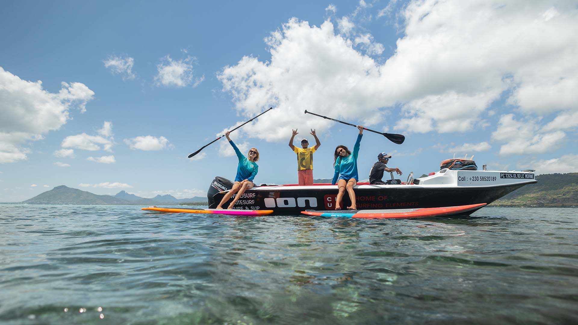 sup with friends in a boat in Mauritius