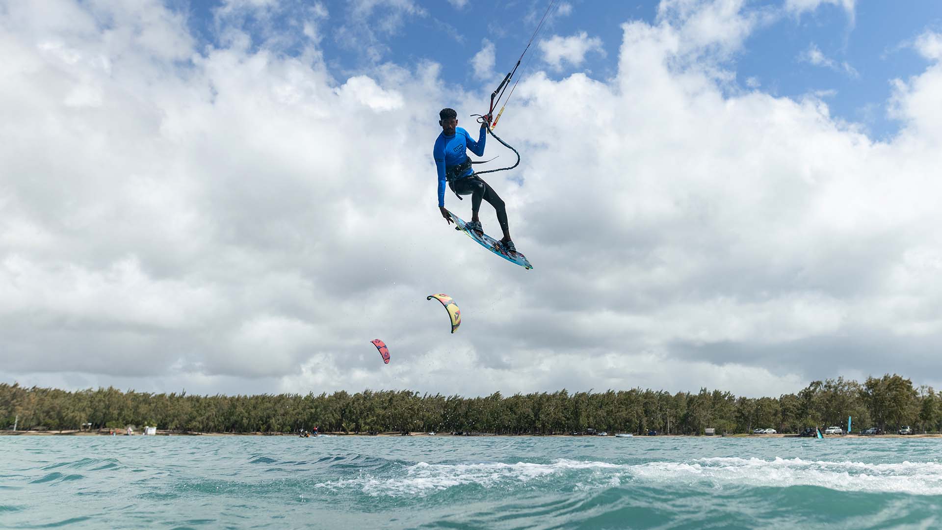 kitesurf jump on the crystal clear water of mauritius