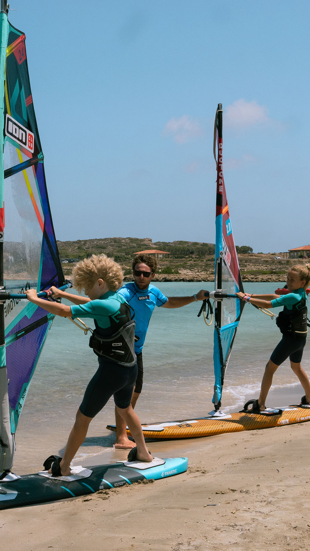 windsurf instructor on the beach with crystal clear water