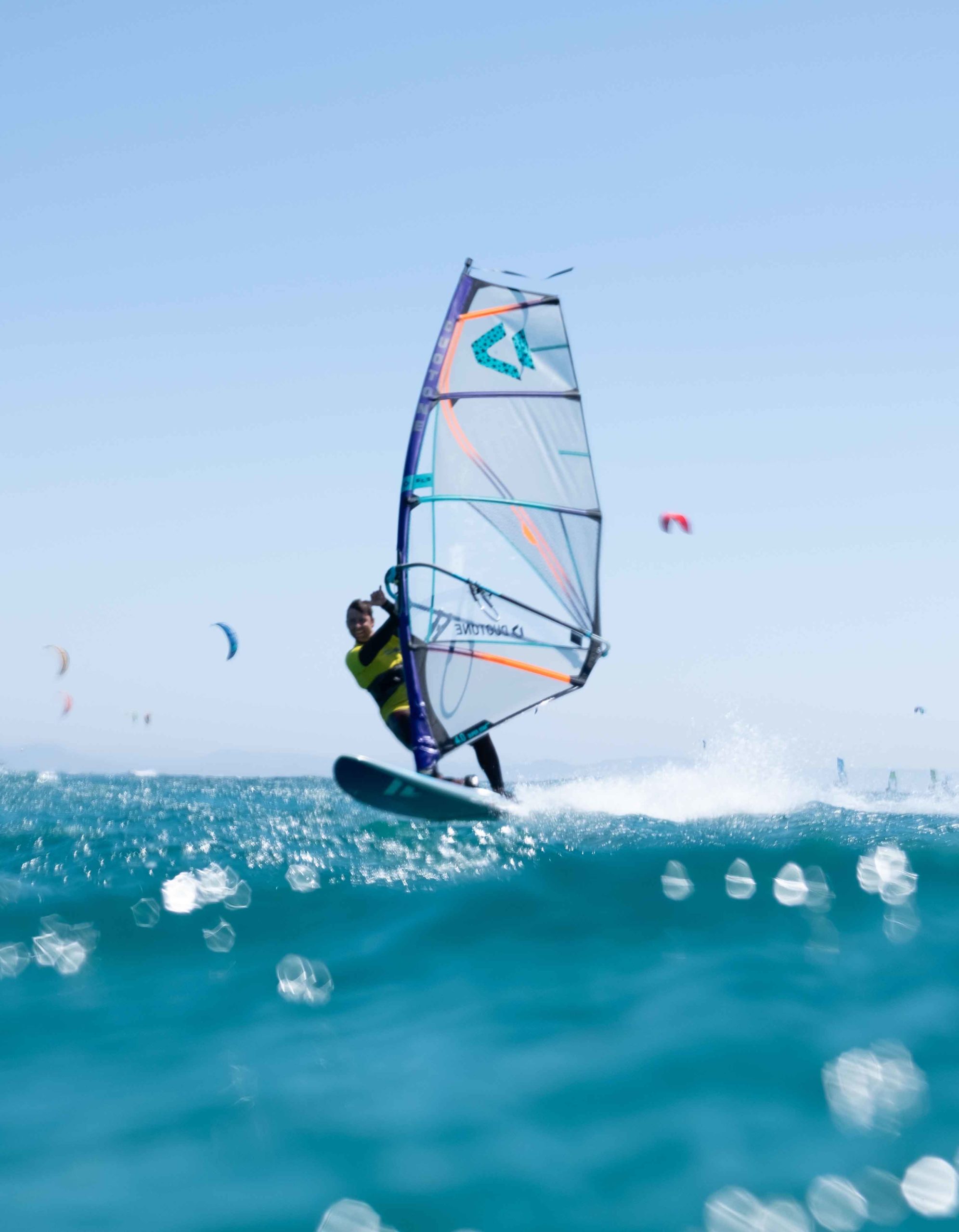 windsurf with turquoise water