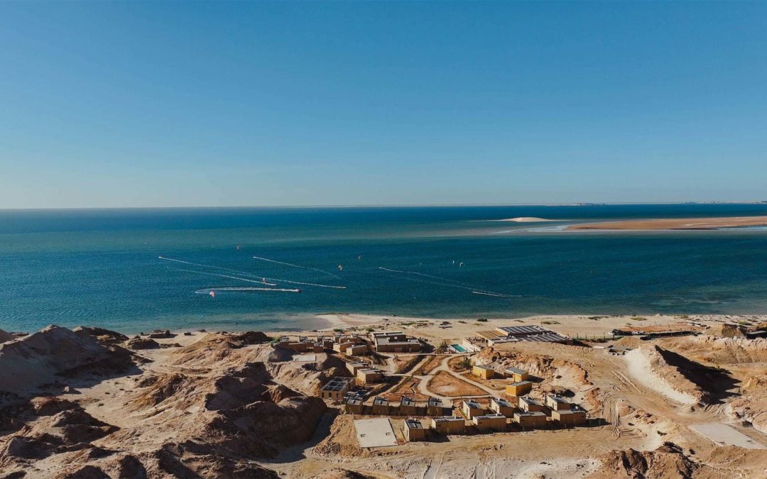 Spot and hotel in front of the white dune in the Sahara desert Morocco dakhla