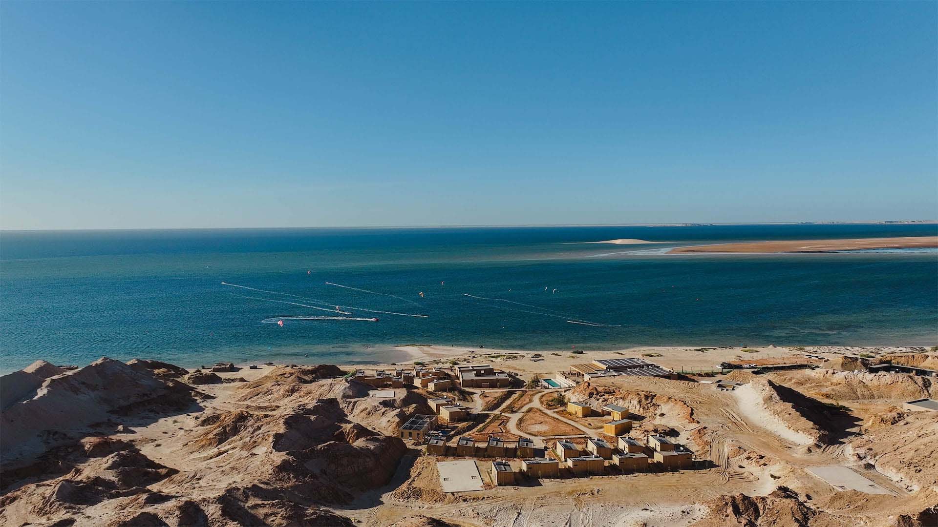 Spot and hotel in front of the white dune in the Sahara desert Morocco dakhla