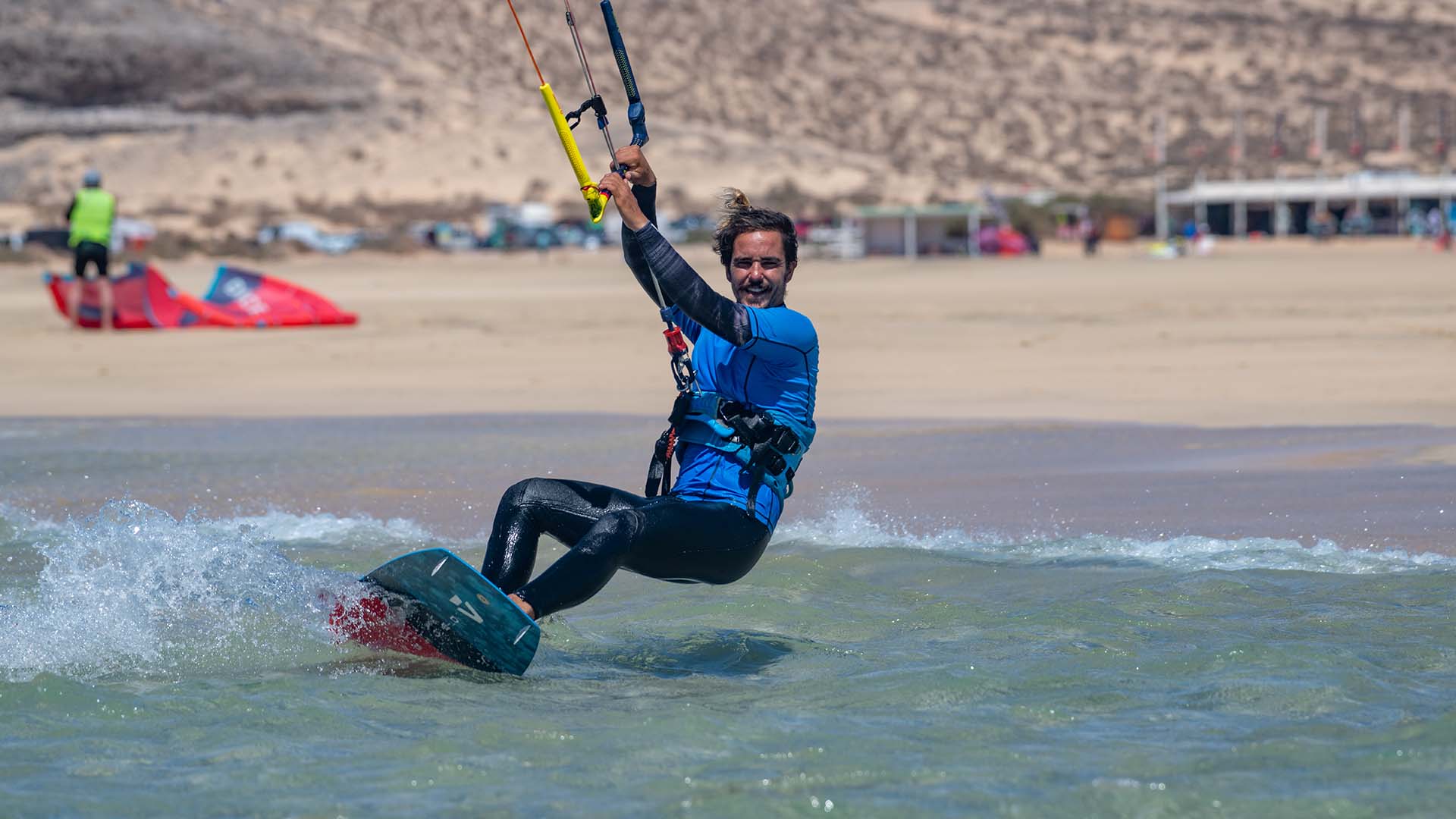 ion harness silver with a kitesurfer on the beach